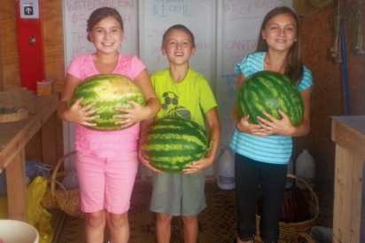Holding watermelons